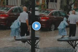 Viral Video Shows A grandfather holding his grandson hand