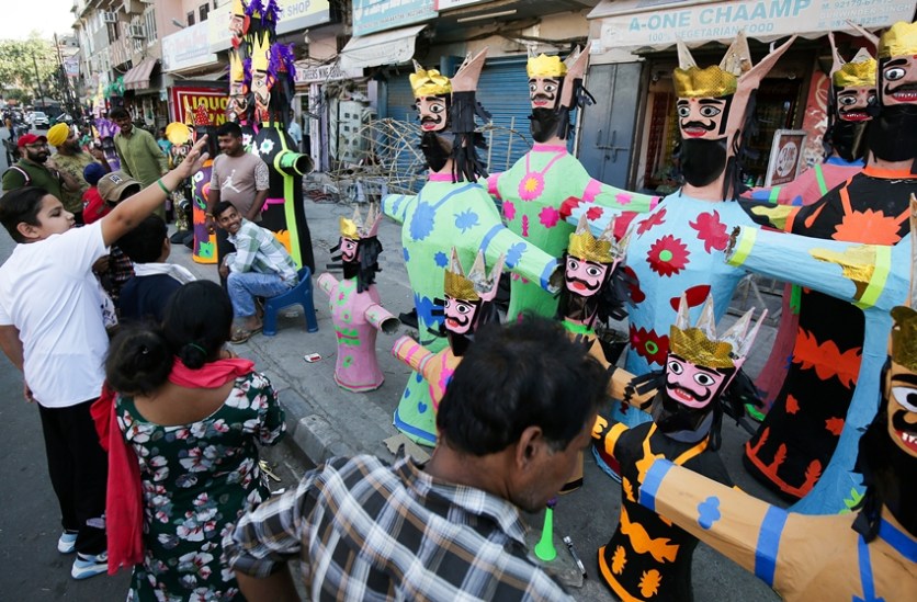 People shop Ravana effigies ahead of the Dussehra festival