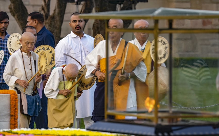  Monks pay homage to Mahatma Gandhi on his birth anniversary.