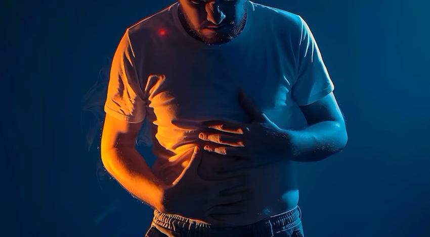 man-experiencing-stomach-pain-neon-lights