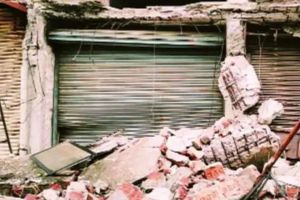 roof of building collapsed at Grant Road possibly trapping some people under debris