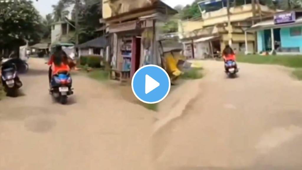 Girl racing up on scooty with a bike fall down badly on scooty shocking funny video goes viral