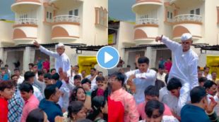 Video an old man dance in varaat wedding by sitting on young mans shoulders