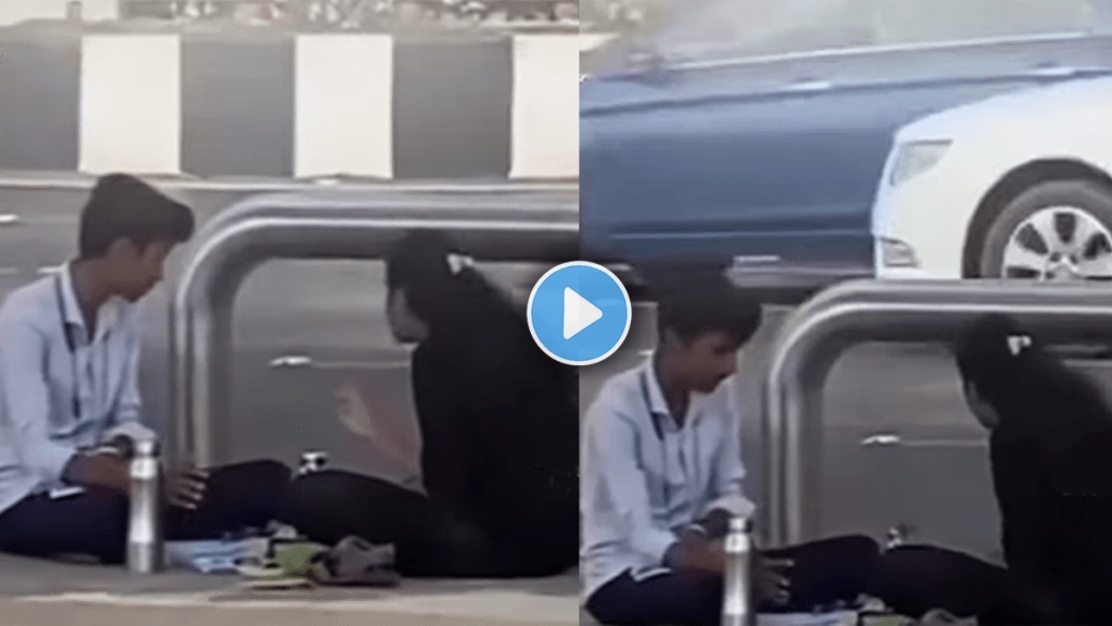 Emotional video of a couple girlfriend seating on a road with boyfriend viral video on social media