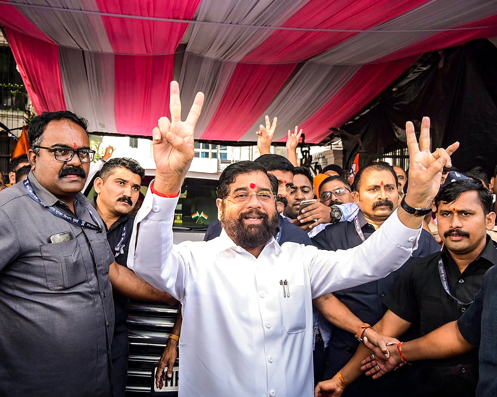 Maharashtra Chief Minister Eknath Shinde and supporters show victory signs as the BJP-led Mahayuti alliance leads in the Maharashtra Assembly elections in Thane. (Photo credit: PTI).