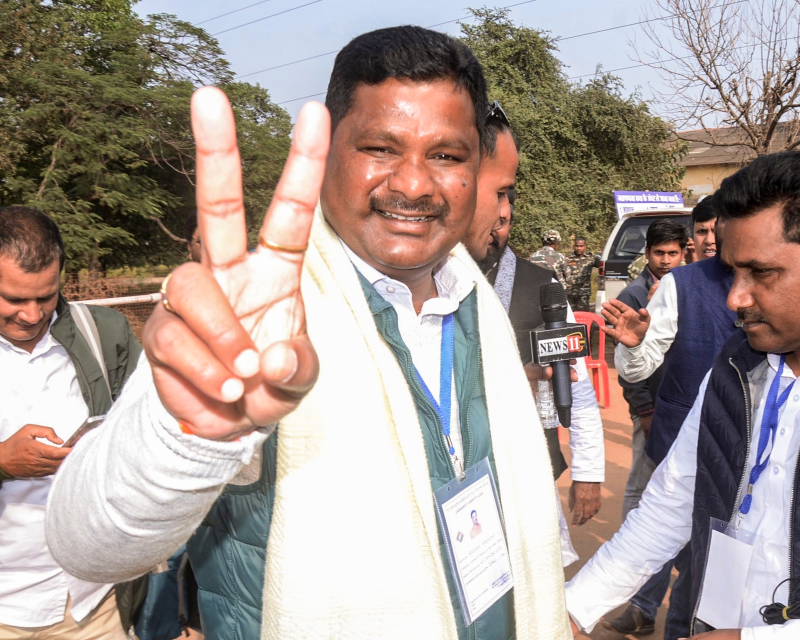 Congress candidate for Khijari assembly seat Rajesh Kachhap flashes victory sign following his decisive lead in the Assembly elections in Ranchi. (Photo credit: PTI)