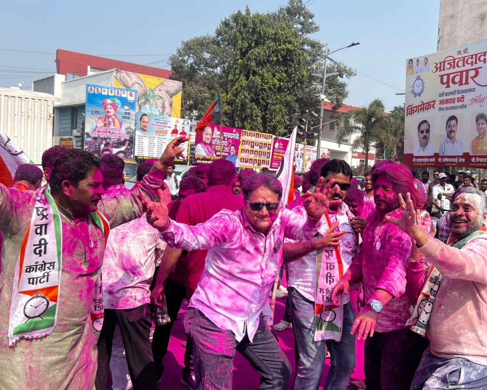 Supporters erupted in celebration at Bhigwan Chowk in anticipation of Ajit Pawar's victory in Baramati, demonstrating their domination in the constituency by dancing to the tunes of Dhol-Tasha and playing with colours.(Express photo: Pavan Khengre)