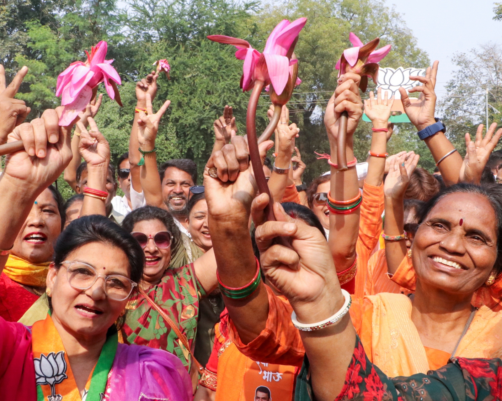 BJP women workers hold lotus while celebrating the NDA's victory in the Maharashtra Assembly elections in Nagpur. (Photo credit: PTI)