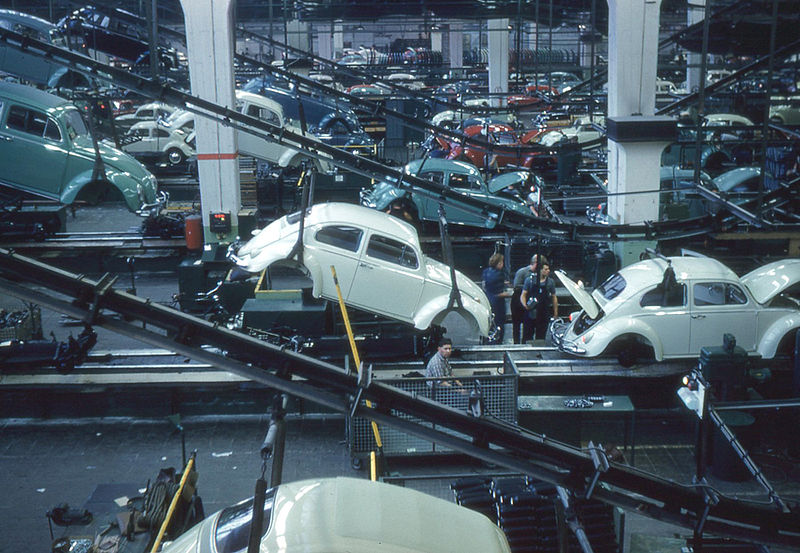 Inside the Volkswagen plant. The bodies are dropped from an overhead line to be attached to the chassis.