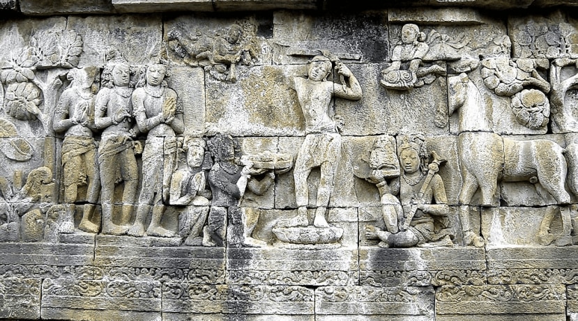 Prince Siddhartha shaves his hair and becomes a śramaṇa. Borobudur, 8th century