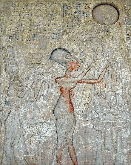 Pharaoh Akhenaten (center) and his family worshiping the Aten, with characteristic rays seen emanating from the solar disk. Later such imagery was prohibited.