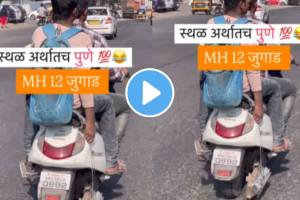 In pune boy drive scooty with holding silencer in hand indian jugaad