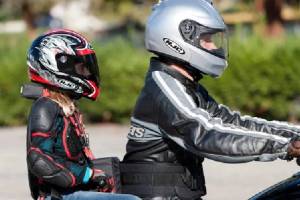 Mandatory helmets on two wheeler along with rider on back seat is a decision that disturbs general public sentiment