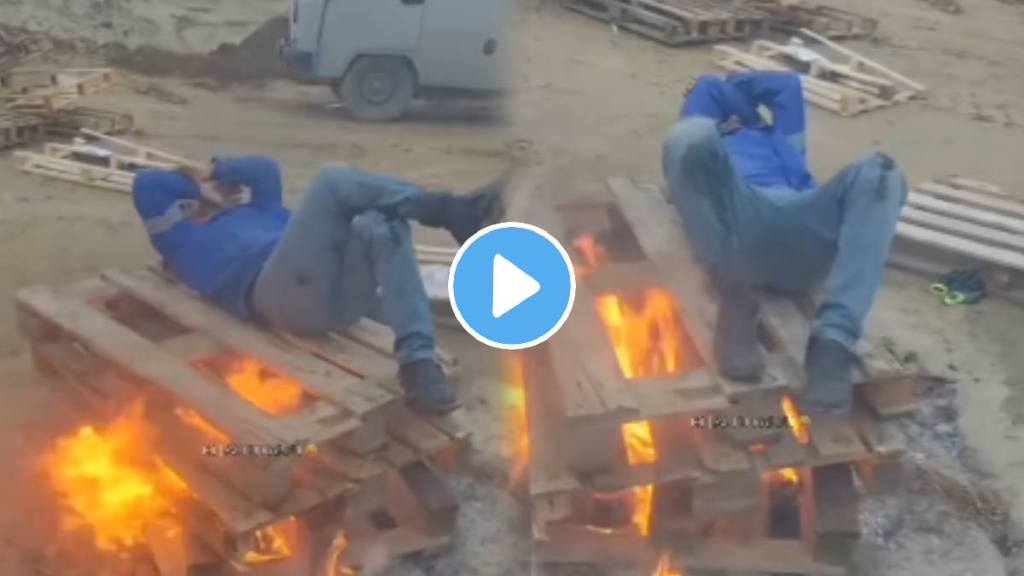 Video viral it was so cold that the person lay down on the burning woods watch this viral video netizans shock