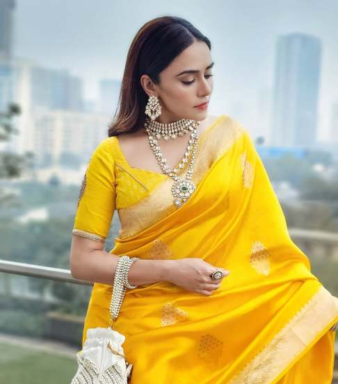 Amruta Khanvilkar shares photos in yellow Banarsi Saree on instagram