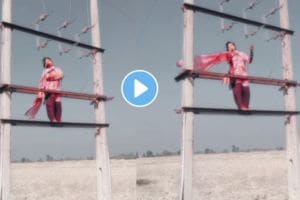 a young girl dance on a electric pole