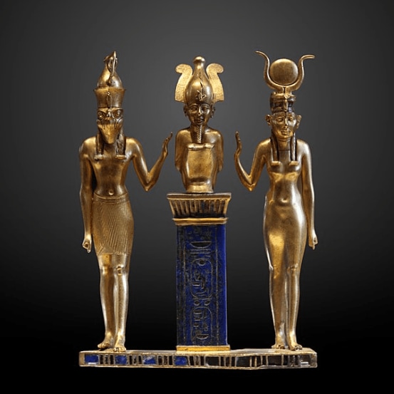 The family of Osiris. Osiris on a lapis lazuli pillar in the middle, flanked by Horus on the left and Isis on the right (Twenty-second Dynasty, Louvre, Paris)