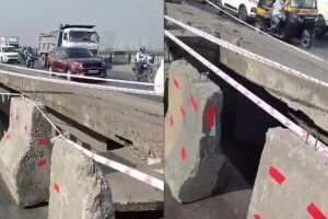 A portion of the divider bridge collapsed Kharegaon flyover