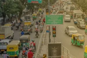 Image of Bengaluru traffic, auto rickshaw, or a related graphic