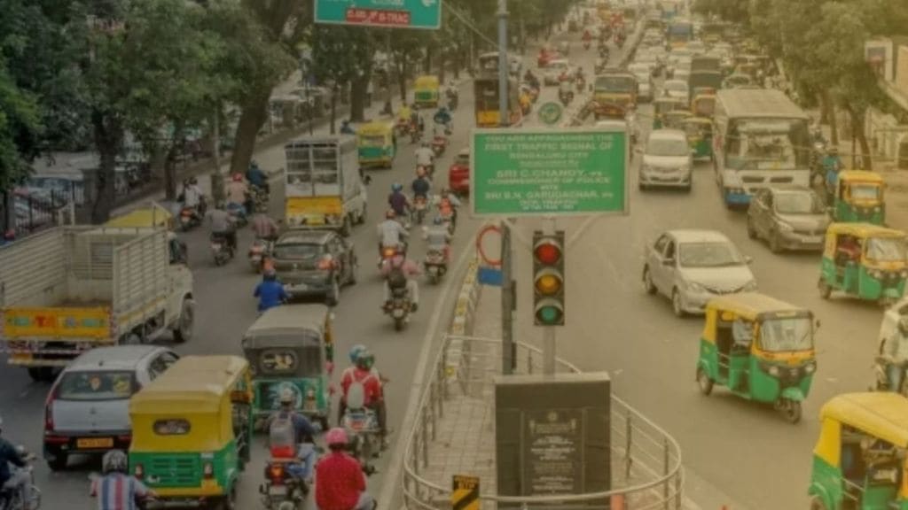 Image of Bengaluru traffic, auto rickshaw, or a related graphic