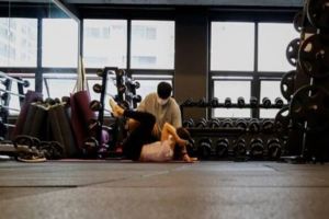 Image of a woman trainer in a gym or swimming pool