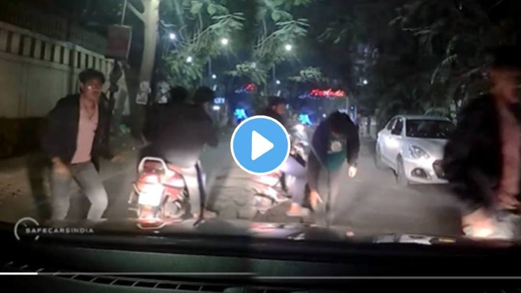 Shocking video pune A Guy in Car attacked by 3 Youths on Scooter Pune street video goes viral