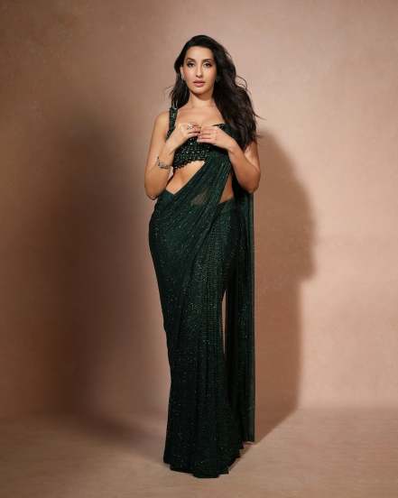 Nora Fatehi shares pictures in green designer saree on social Media for her release of new song snake