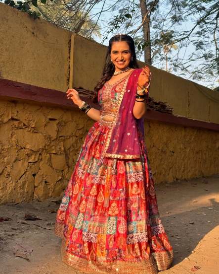 Palvi Kadam Shares pictures in Red Lehenga From The Sets of Aai Baba Retire Hot Ahe on social media