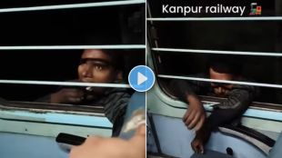 Thief calmly hangs from window of moving train in dangerous stunt