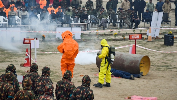 Prayagraj: Priests perform Ganga Aarti on a cold winter evening at Dashashwamedh Ghat. (PTI Photo)