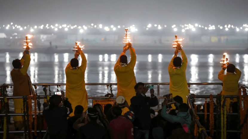 Prayagraj: Priests perform Ganga Aarti on a cold winter evening at Dashashwamedh Ghat. (PTI Photo)