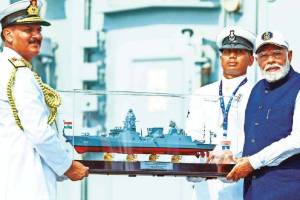 prime minister narendra modi dedicates two frontline naval warships and submarine to the nation