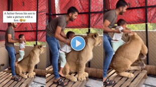 A father forces his son to take a picture with a lion