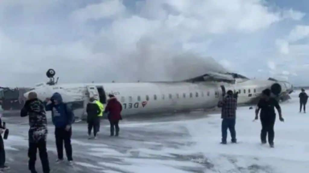 Delta Airline crash: Passengers survive after plane lands upside down, showcasing emergency evacuation efforts.