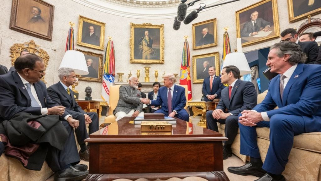 Narendra Modi and Donald Trump shake hands during their meeting discussing defense, trade, and global partnerships.