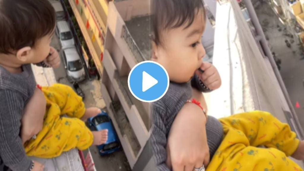 Mother making reels while holding baby in building open terrace shocking video goes viral