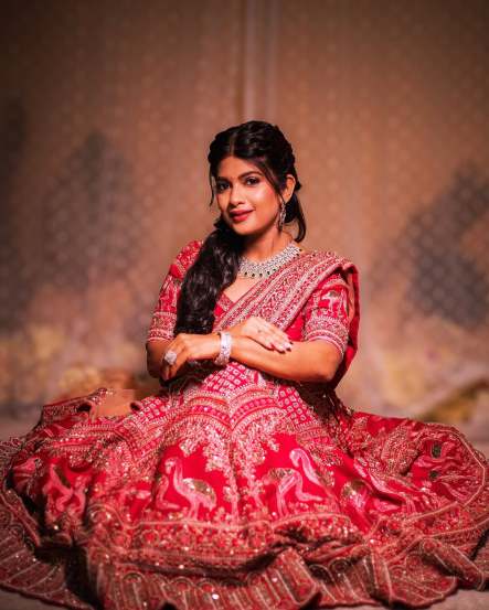 Dhanashri Kadgaonkar shares pictures in traditional red designer lehenga on social media 