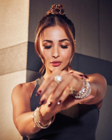 Malaika Arora shares pictures in grey tank top and bodycon skirt with unique diamond jewellery on social media