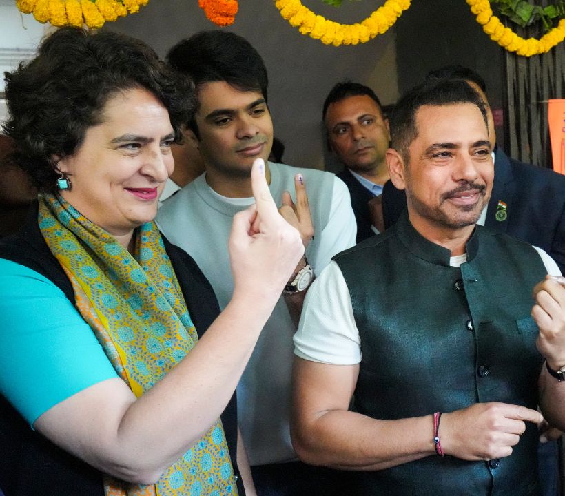 Congress MP Priyanka Gandhi Vadra, along with her husband Robert Vadra and son Raihan, cast their votes at Lodhi Estate. (PTI Photo)