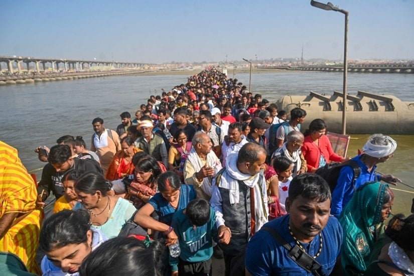 Devotees on a pontoon bridge