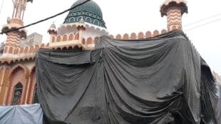 Mosques in Aligarh covered with tarpaulins for Holi celebrations as police ensure security.