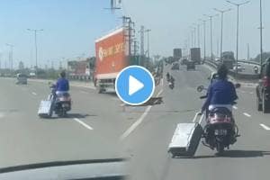 indian jugaad girl drive a scooty with one hand and a suitcase with the other vidoe on the highway goes viral