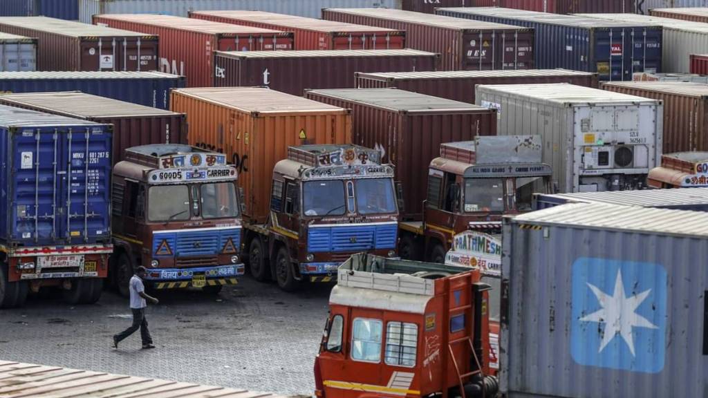 despite a state of the art parking lot at jnpt Port heavy containers are parked on roads and open spaces