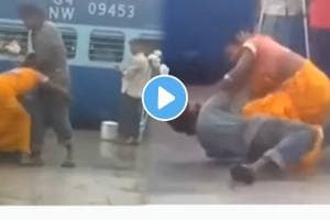 Wife badly beaten husband at th railway station video goes viral on social Media