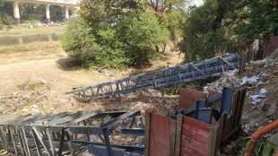 municipal administration demolished skeleton of illegal hoarding erected near Chhatrapati Sambhaji Maharaj Bridge