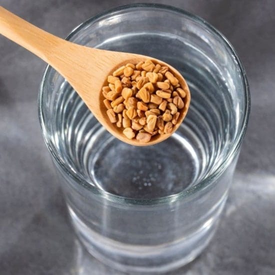 Spoon with fenugreek grains