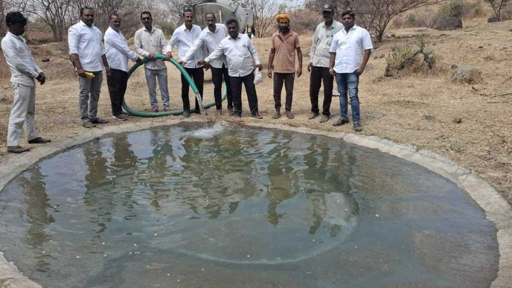 tankers water discharging to reservoir in Baramati